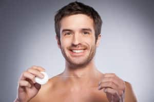 Man with dental floss.